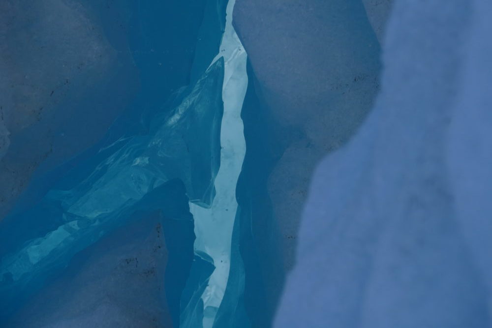 Glacial ice, spring afternoon at snout of Reid Glacier